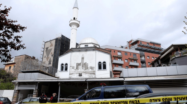 Police stand outside Dine Hoxha mosque after a knife attack in Tirana, Albania, Monday, April 19, 2021. Police say an Albanian man with a knife has attacked five people at a mosque in the capital of Tirana. A police statement said Rudolf Nikolli, 34, entered the Dine Hoxha mosque in downtown Tirana about 2:30 p.m. and wounded five people with a knife. (AP Photo)


