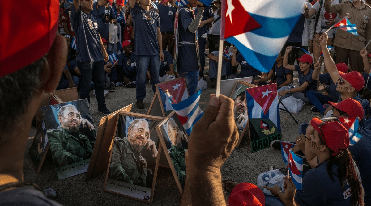 No electronic distribution, Web posting or street sales before MONDAY 3:01 A.M. ET APRIL 19, 2021. No exceptions for any reasons. EMBARGO set by source.** FILE — A shouting crowd awaits the funeral service for Fidel Castro, at the Plaza de la Revolución in Santiago, Cuba, Dec. 2, 2016. Raúl Castro is preparing to step down as head of Cuba’s Communist Party, leaving Cubans without a Castro to lead them for the first time in over 60 years. (Mauricio Lima/The New York Times)
