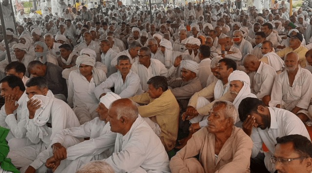 Farmers participate in a khap mahapanchayat held at Khatkar toll plaza of Jind. (Express Photo)