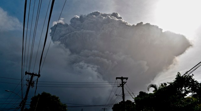 Ash rises into the air as La Soufriere volcano erupts on the eastern Caribbean island of St. Vincent on Friday. (AP)