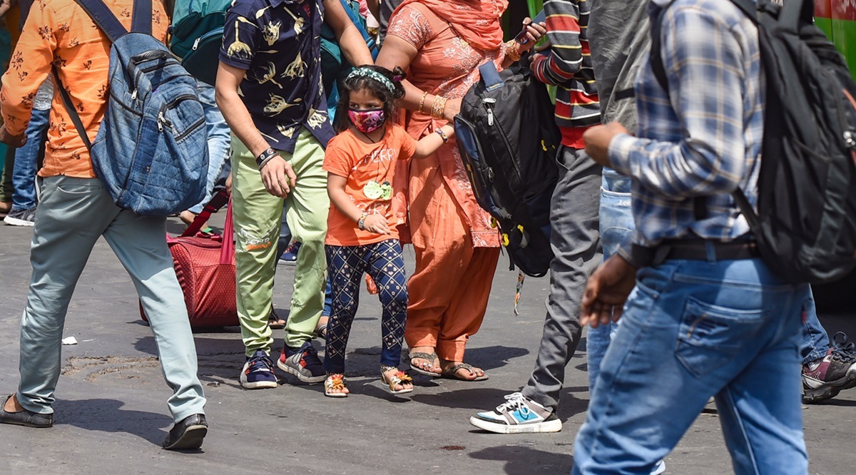 Passengers at Anand Vihar Bus Terminal in New Delhi, Wednesday, April 14, 2021. (PTI Photo/Manvender Vashist, File) 