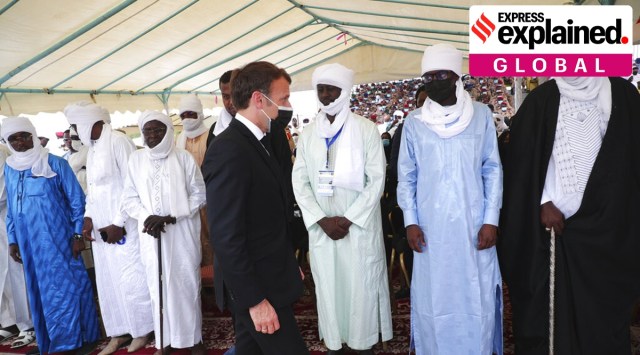 French President Emmanuel Macron, center, flanked by the son of the late Chadian president Idriss Deby, Mahamat Idriss Deby, left, arrives to attend the state funeral for the late Chadian president Idriss Deby in N'Djamena, Chad, Friday, April, 23, 2021. (AP)