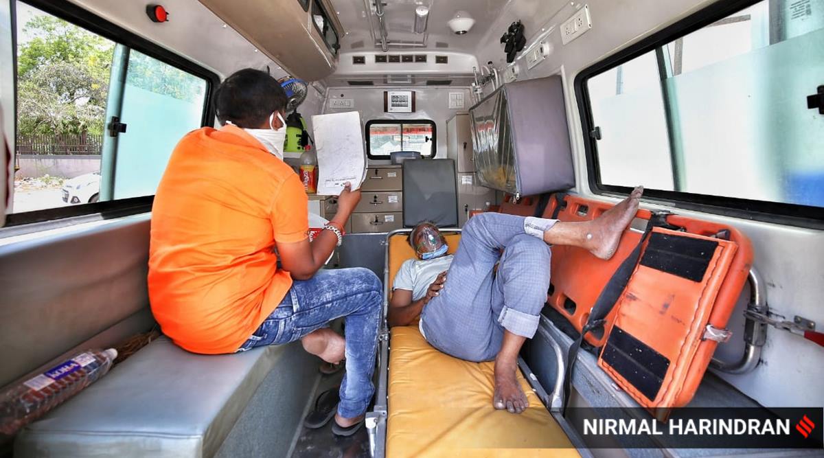 Covid patients with oxygen support wait to get admission at Civil hospital in Gandhinagar. 
(Express photo by Nirmal Harindran)