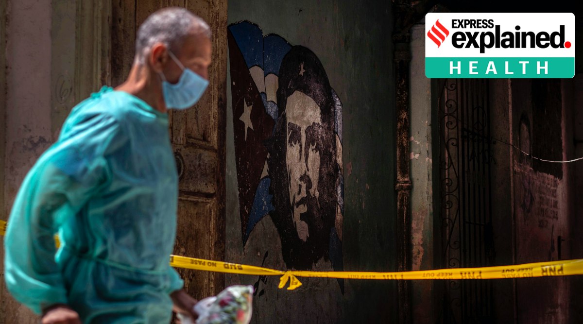 A health worker wearing a mask as a precaution against the spread of the new coronavirus walks in front of the entrance of a quarantined house in Havana, Cuba, Wednesday, April 7, 2021. (Photo: AP Photo/ Ramon Espinosa)