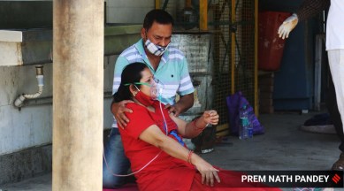 Oxygen is provided to a Covid-19 positive patient in New Delhi (Express Photo: Prem Nath Pandey)