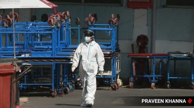 A health worker in PPE  outside Covid ward at AIIMS Hospital in New Delhi on Saturday.