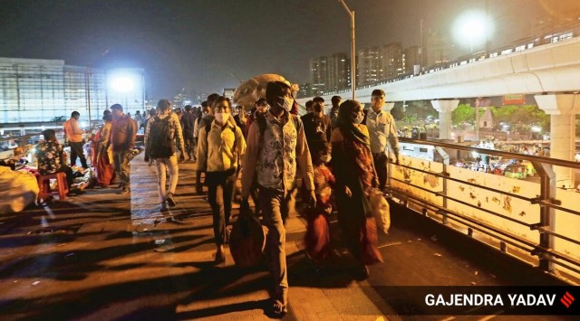 Migrant workers at Anand Vihar ISBT in New Delhi on Thursday night.