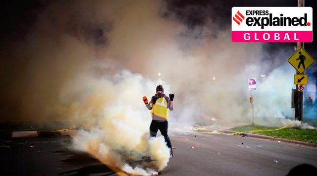 Police fire dispersants into a crowd of protesters outside the Brooklyn Center Police Department, late Sunday, April 11, 2021, in Brooklyn Center, Minn. (Jeff Wheeler/Star Tribune via AP)