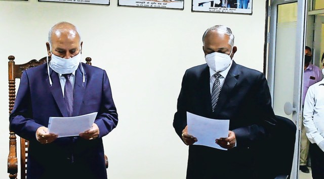 SK Yadav (right) takes oath as  Deputy Lokayukta in Lucknow, Monday. (Express photo)