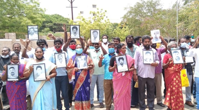 Protestors raise slogans in front of the collector's office