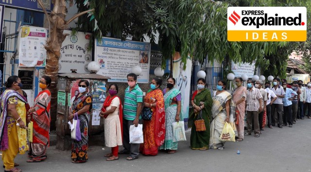 People stand in queue to receive the Covid-19 vaccine, in Kolkata on Wednesday. (Express Photo: Partha Paul)