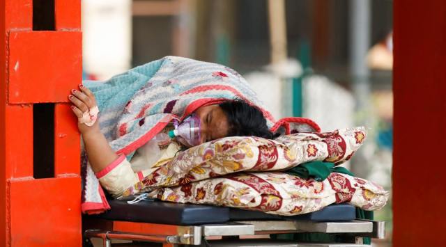 A patient receives oxygen as she waits outside the passage of a hospital due to a lack of free beds inside the hospital for coronavirus disease (COVID-19) patients, as the second major coronavirus wave surges in Kathmandu, Nepal, May 10, 2021. (Image credit: Reuters)