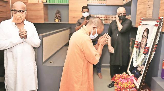 CM Yogi Adityanath pays tribute to the mother of Additional Advocate General Vinod Shahi at latter’s residence, Sunday. 