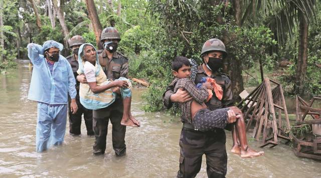 Army personnel rescue people in Bodhra village in Purba Medinipur. (Express Photo by Partha Paul)