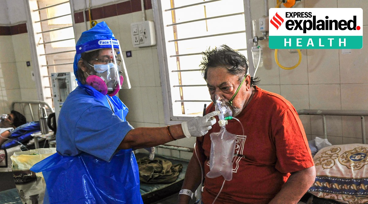 A health worker checks a Covid-19 patient on oxygen support at a hospital, during the second wave of the coronavirus pandemic in Bengaluru. (PTI Photo)