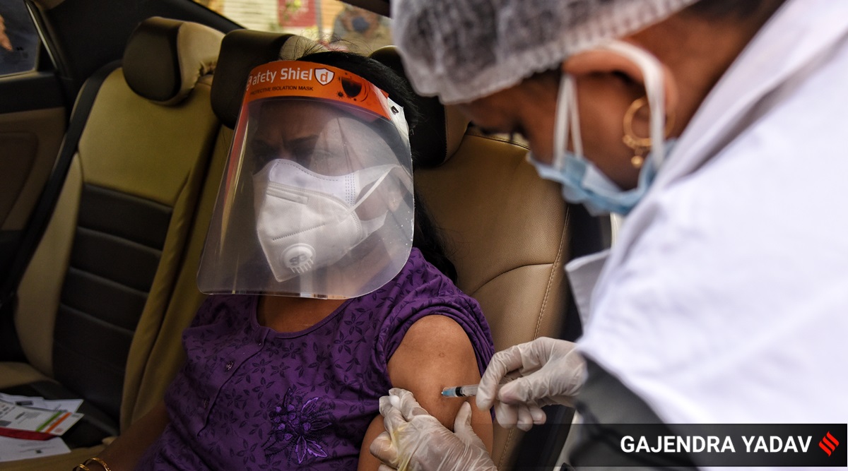 A drive through Covid-19 vaccination facility (Express Photo: Gajendra Yadav, File)