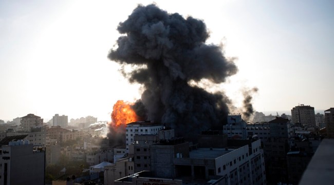 Smoke and fire rises following Israeli airstrikes on a building in Gaza City.