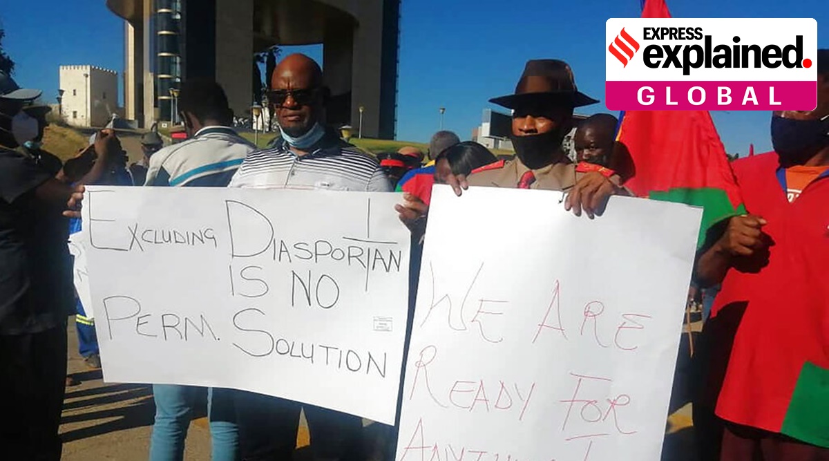 People hold banners as they stage a protest in Windhoek, Namibia, Friday May 28, 2021. (AP Photo)