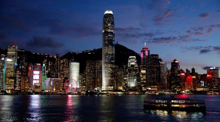 A Star Ferry boat crosses Victoria Harbour in front of a skyline of buildings during sunset. Hong Kong, China June 29, 2020. (REUTERS)