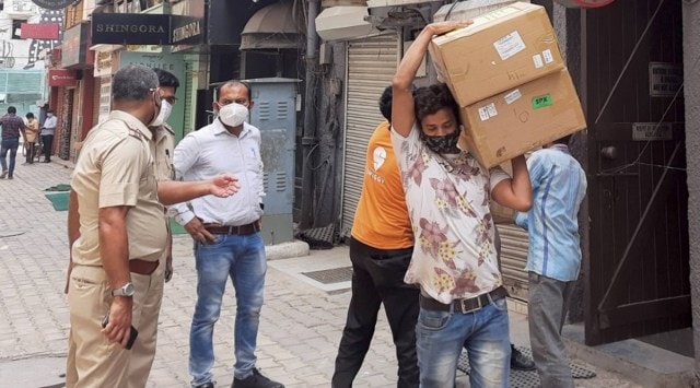 Oxygen concentrators being taken away following the raid at Khan Chacha restaurant in Khan Market, New Delhi, on Friday. (PTI)