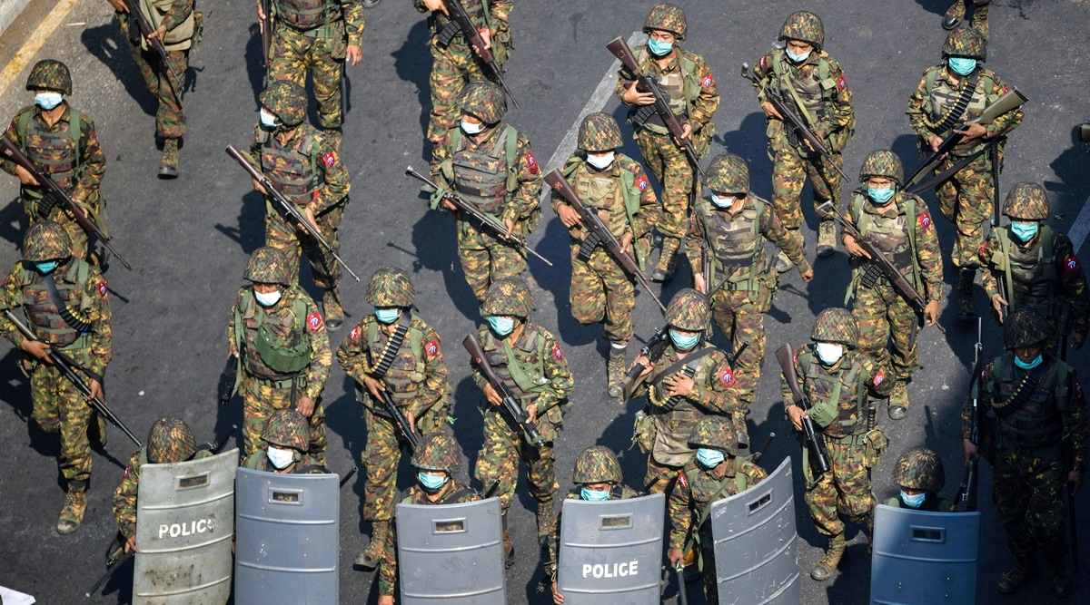 Myanmar soldiers walk along a street during a protest against the military coup in Yangon, Myanmar, February 28, 2021. (Reuters)
