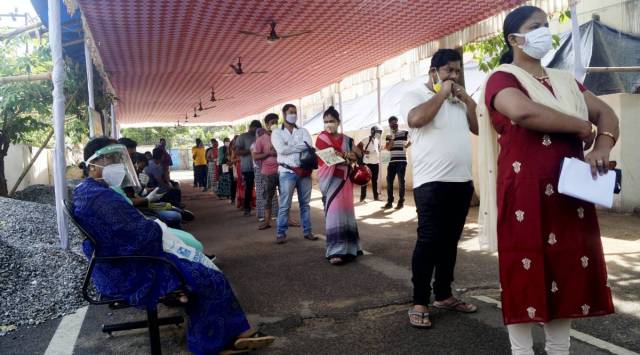 Beneficiaries stand in a queue to receive COVID-19 vaccine dose, at Capital hospital in Bhubaneswar, Friday, May 14, 2021. (PTI Photo)