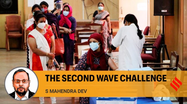 A woman is administered a dose of Covishield as others wait their turn in Bengaluru (AP)