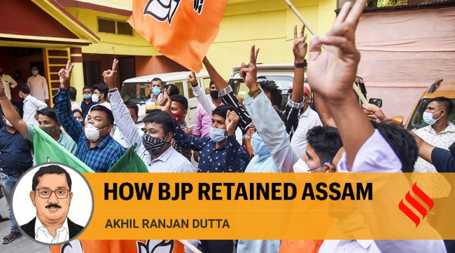 BJP activists celebrate after getting the majority in the Assam Assembly elections at BJP head office in Guwahati (PTI)