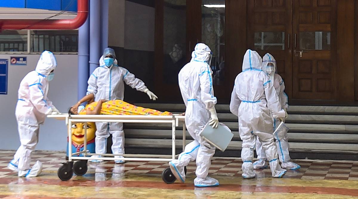 Health workers wearing PPE suit, admit a Covid patient amid the pandemic. Image used for representation. (PTI)