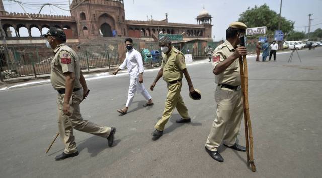 Delhi Police personnel patrol outside a deserted Jama Masjid. (PTI)