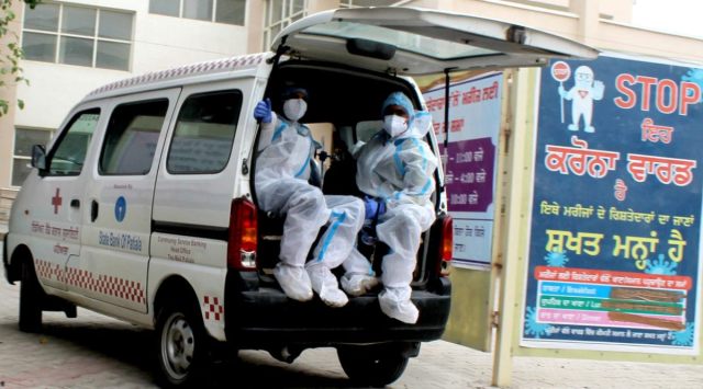 Health Workers take Covid-19 Patients to Covid Care Ward at Government Rajindra Hospital in Patiala on Tuesday. (Express Photo by harmeet Sodhi)