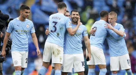Manchester City players celebrate a goal against Everton in the Premier League. (AP)