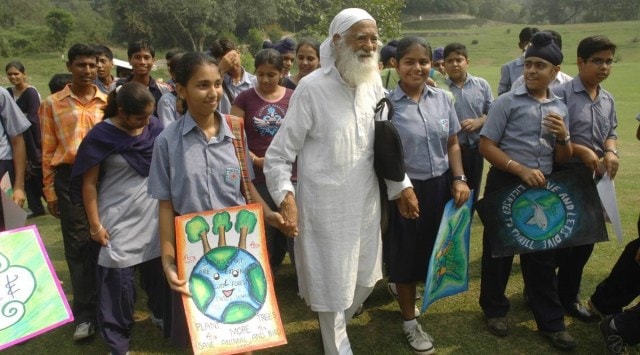 File photo of environmentalist Sunderlal Bahuguna celebrating wildlife day with students at Nepli forest on Thursday. (Express photo by Jaipal Singh/File)