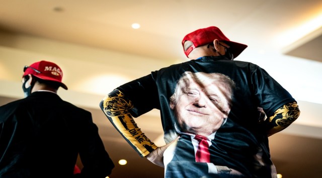 FILE Ñ A manÕs shirt emblazoned with an image of former President Donald Trump at the Conservative Political Action Conference (CPAC) in Orlando, Fla., Feb. 28, 2021.  (Erin Schaff/The New York Times)