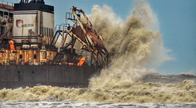 Rough sea waves crash against the Bhagavathi Prem Sinken Dredger, at Surathkal Beach near Mangaluru on Sunday. (PTI)