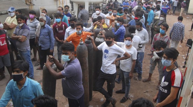 Family members of Covid-19 patients queue up to refill oxygen cylinders in Kanpur on Saturday. (PTI) 