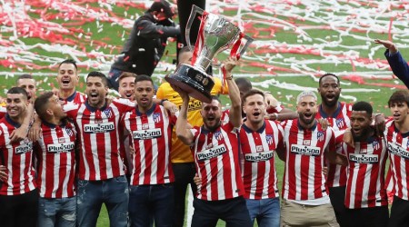 Atletico Madrid's Koke lifts the trophy as they celebrate after winning La Liga. (Reuters)