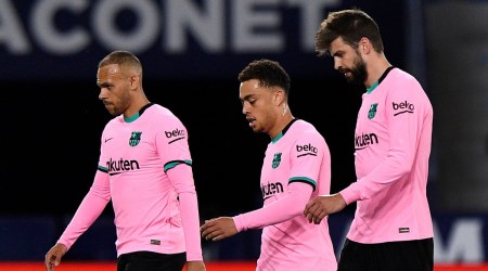 In this file photo, Barcelona's Gerard Pique, Sergino Dest and Martin Braithwaite look dejected. (Source: Reuters)