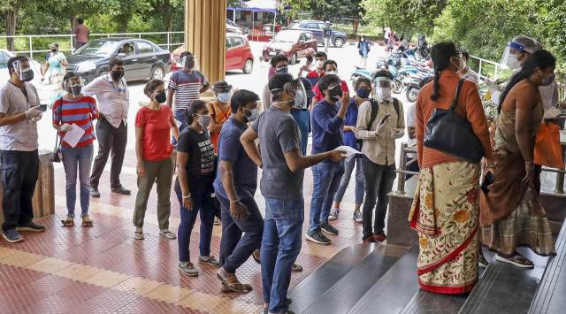 Vaccine beneficiaries stand in a queue to receive their jab at Bengaluru's CV Raman Hospital. (PTI)