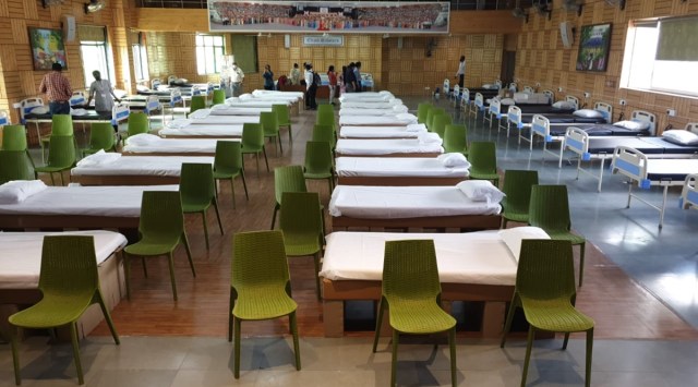 Covid care beds at Mount Carmel School's auditorium in Delhi. (Express)