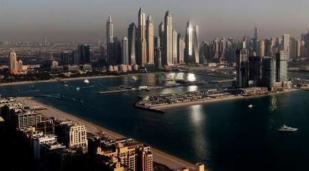 Luxury towers dominate the skyline in the Marina district, center, and the new Dubai Harbour development, right, are seen from the observation deck of "The View at The Palm Jumeirah" in Dubai, United Arab Emirates, Tuesday, April 6, 2021. (AP Photo)