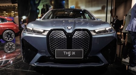 With a glossy black lattice in place of the trademark vertical bars, the kidney-shaped grills on BMW's next generation electric vehicles generate at least as much chatter as the cars' electric guts. (Bloomberg)
