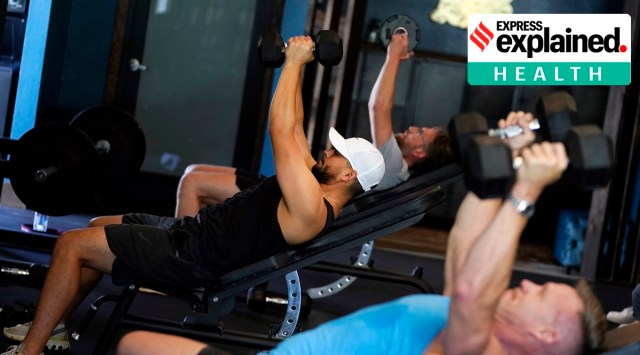 A group lift weights in a fitness class at Lift Society Friday, May 21, 2021, in Studio City, Calif. (AP Photo/Marcio Jose Sanchez)