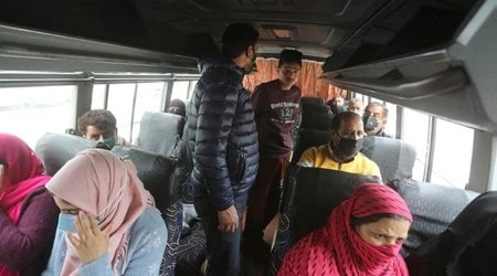 Traffic Police officials checking if passengers traveling in public transport are follow Covid-19 guidelines in Srinagar. (Express Photo)