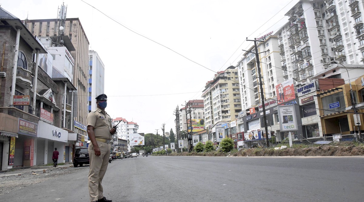 A policeman patrols a vacant road in Kochi. (PTI Photo)