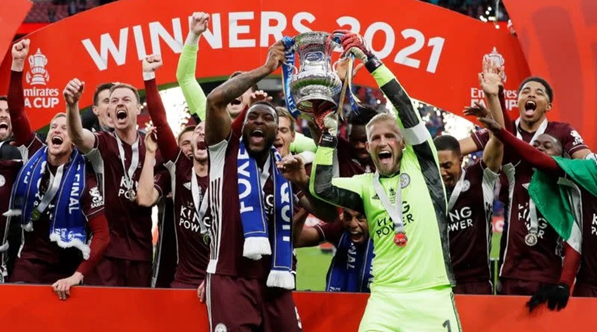 Porto players celebrate as they lift the trophy after beating