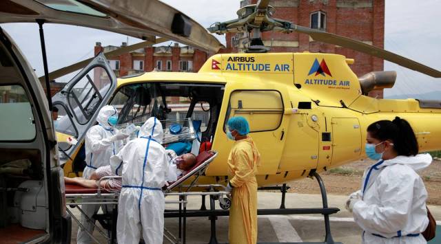 As COVID rampages across Nepal, workers pay the price