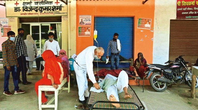 Dr V K Sharma with a patient at his clinic in village Bargaon in Saharanpur on Thursday. (Photo: Praveen Khanna)