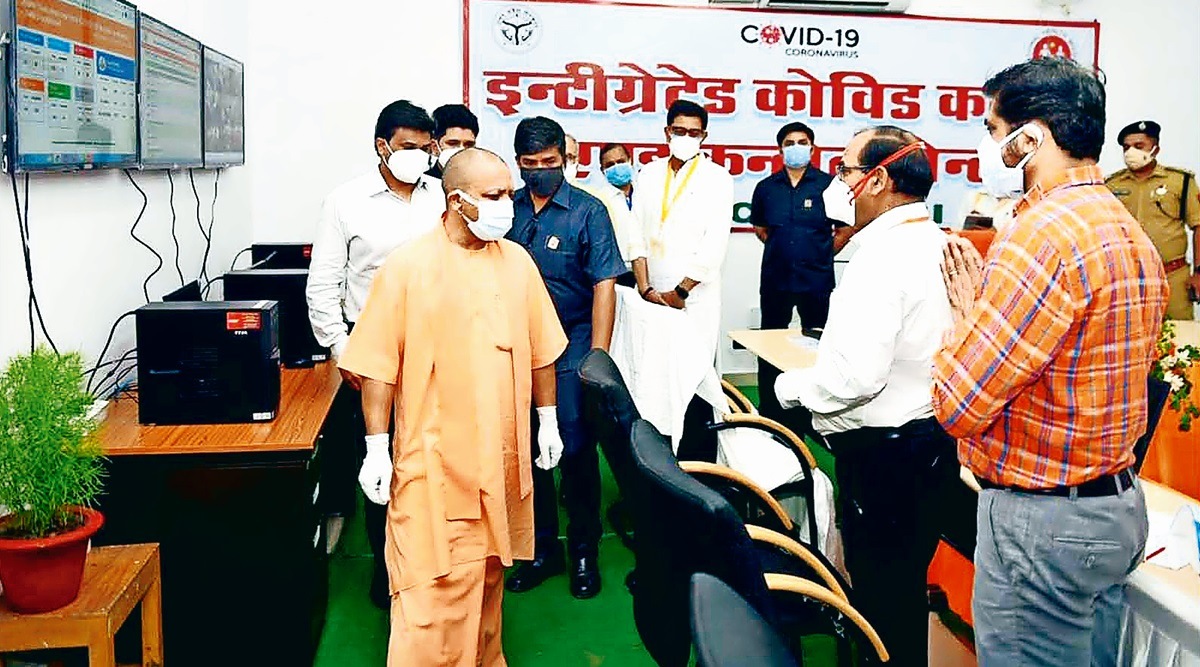 Chief Minister Yogi Adityanath at Jhansi Integrated Covid Command Centre on Sunday. (Express photo)