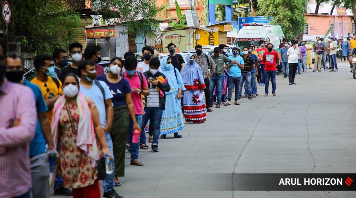 Huge number of beneficiaries line up for their first dose of Covid vaccine at Oyster and Pearl Hospital in Shivajinagar,  Pune. (Express Photo)